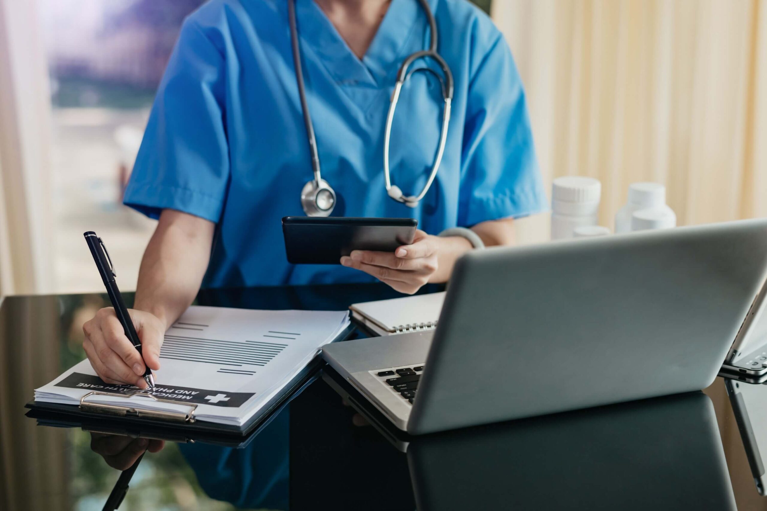 Doctor working with mobile phone