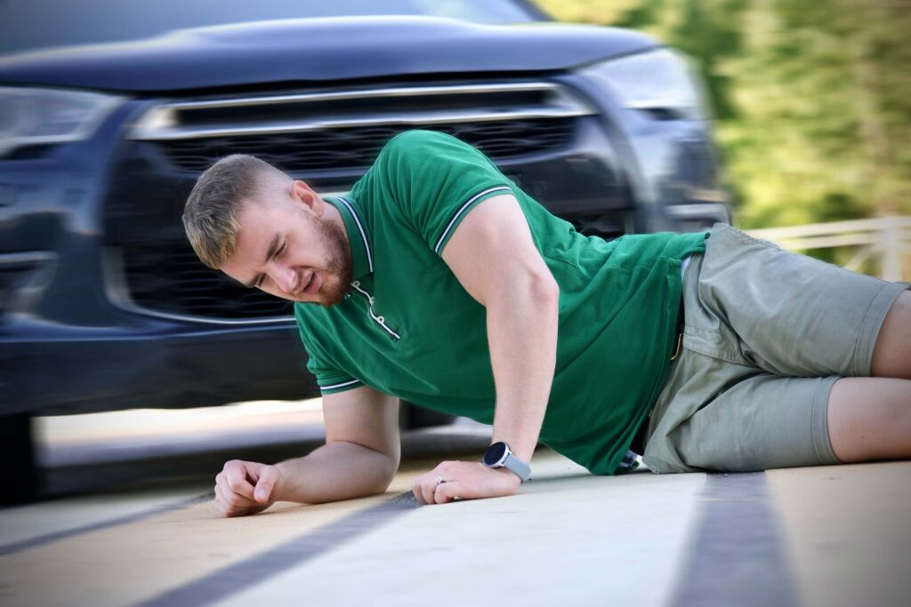 Pedestrian man hit by careless driver in car